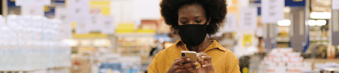 Woman using a cellphone to personal shop