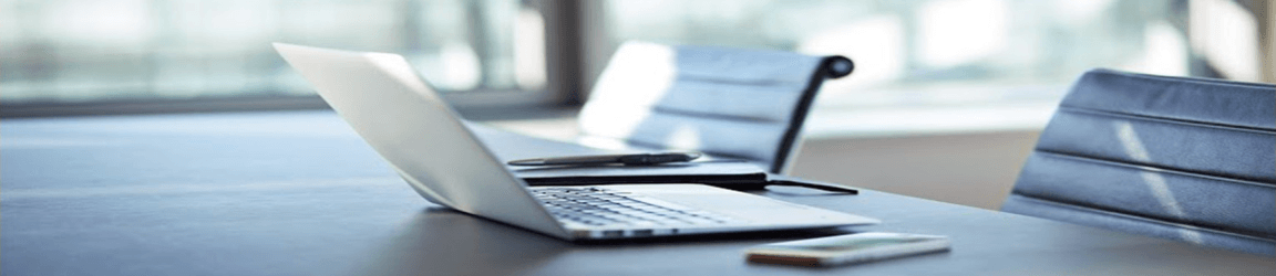 Laptop and phone on desk