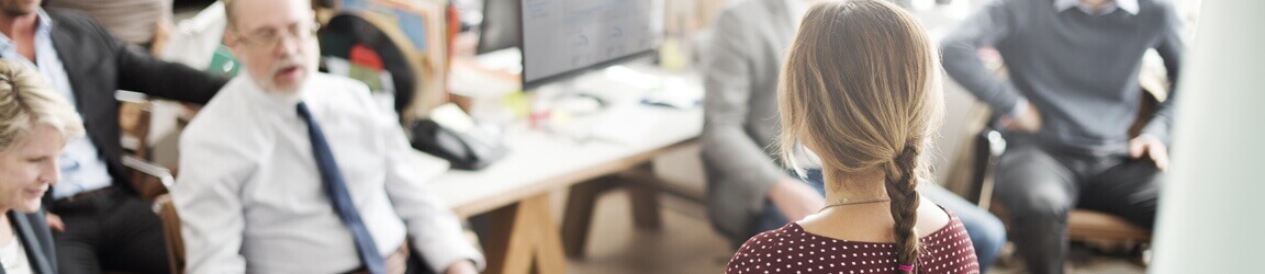 Woman leading office meeting