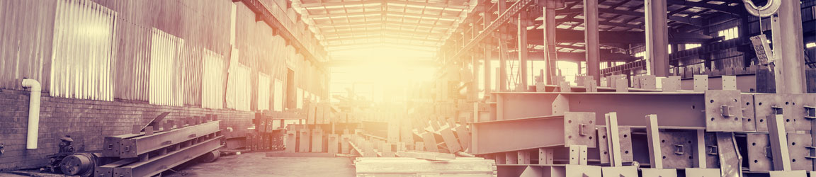 Sunlit manufacturing building with steel beams