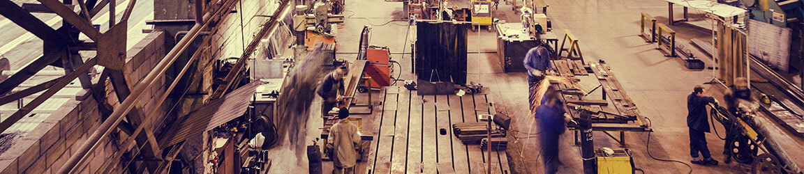 Workers assembling on a manufacturing room floor