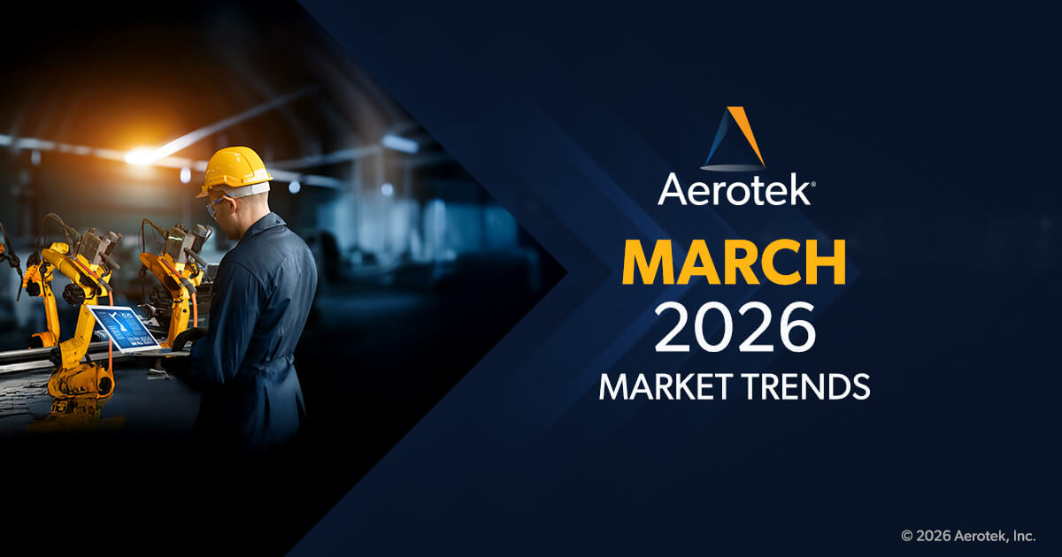 Preventative maintenance technician in hardhat and safety goggles stands in front of yellow robotic arms, reviewing maintenance logs on a laptop. "Aerotek March 2026 Market Trends" caption  is on the right.