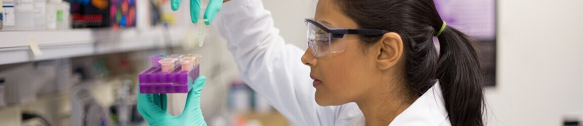 Medical researcher examining specimen in lab