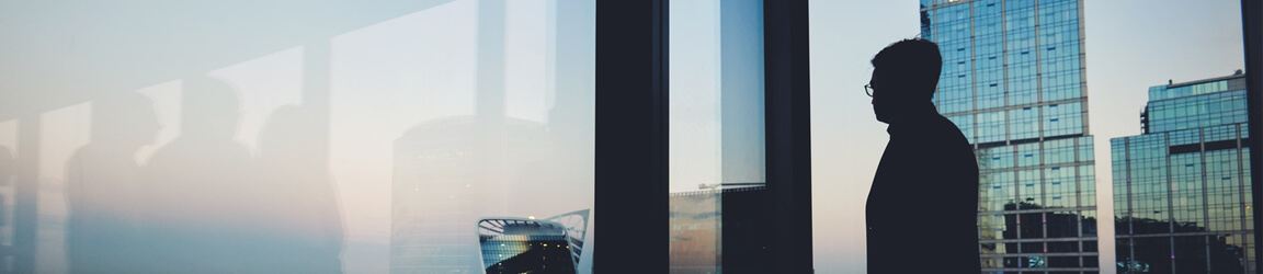 man looking out the window