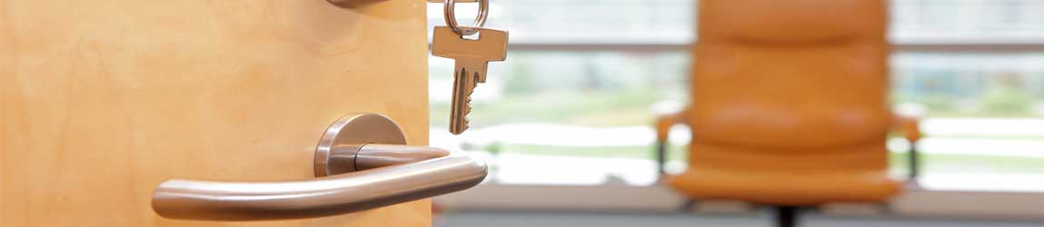 Open office door with empty chair
