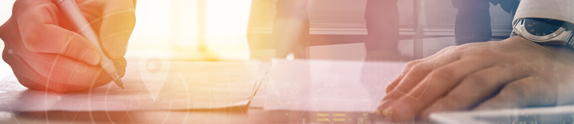 Person signing document with transparent graphic overlayed on top of photo