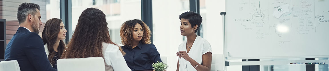 diverse team of five in a meeting