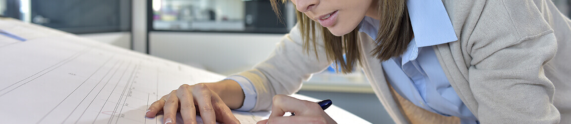 Woman drawing plans