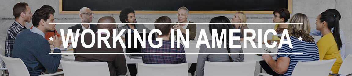 Working in America text written over an image of a business group working round a large table