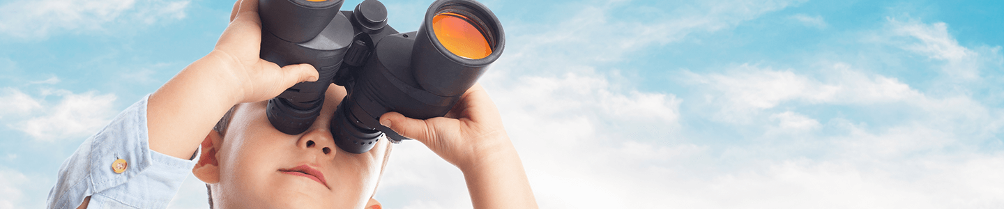 Boy looking through binoculars