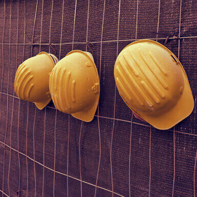 Three yellow hard hats