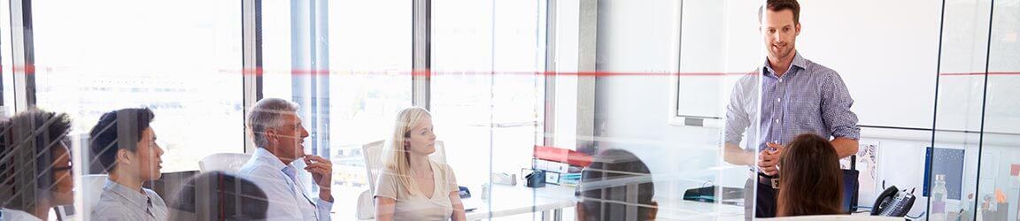 Man leading a business meeting in a modern office
