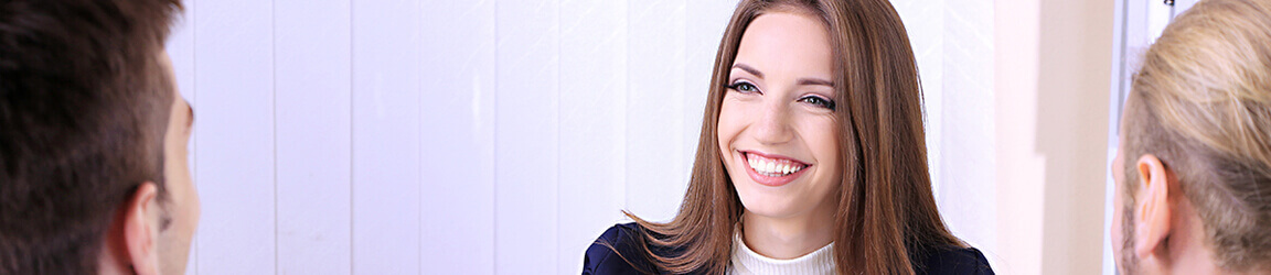 Female business professional smiling during a meeting