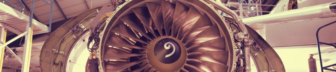 Closeup of airplane engine in a hangar