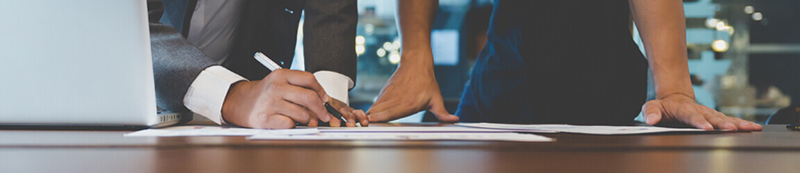 Business people working on documents in an office